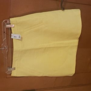 NWT Soft yellow mini skirt with back zipper